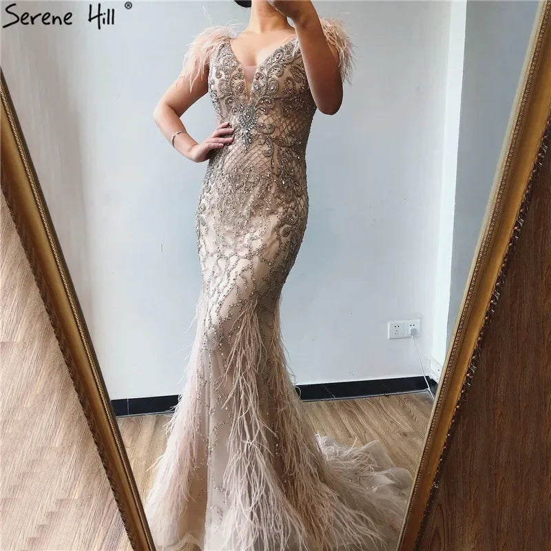 Evening dress with asymmetrical hem-Serene Hill Champagne Mermaid Elegant Evening Dresses Diamond Feathers Sleeveless Formal Luxury Beaded 2024 LA70350